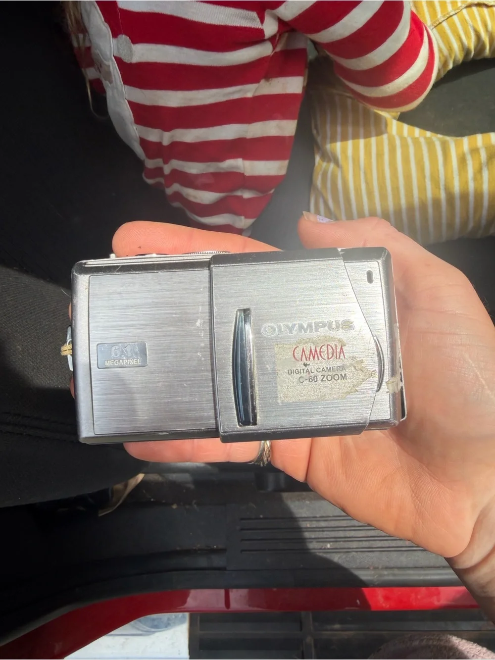 Olympus Silver Compact Slide-Lens Digital Camera works and comes with charger